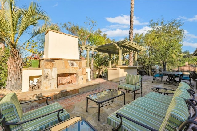 view of patio with a pergola and exterior fireplace