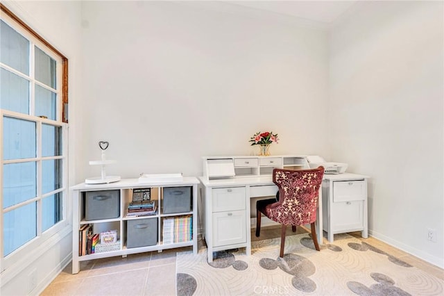 office space featuring crown molding and light tile patterned floors