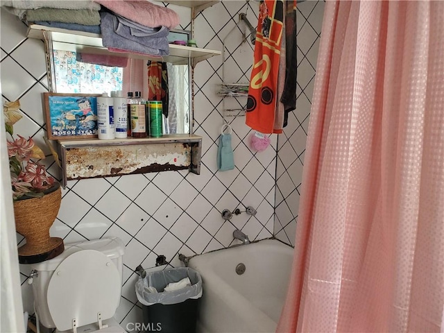 bathroom featuring toilet and shower / bathtub combination with curtain