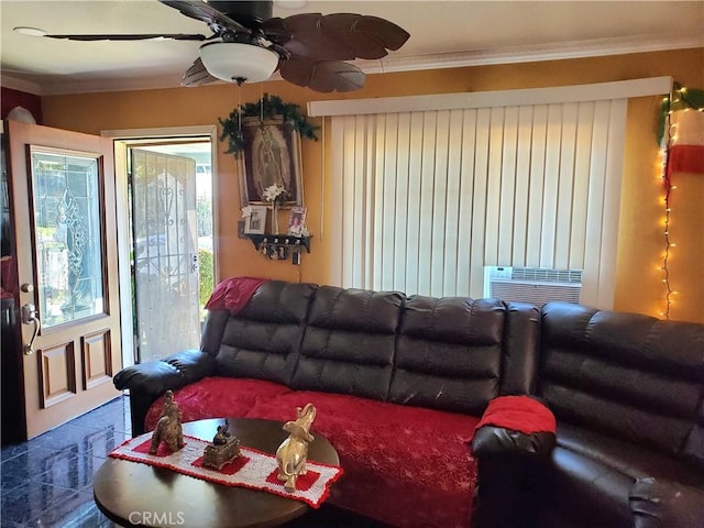 living room with ceiling fan and ornamental molding