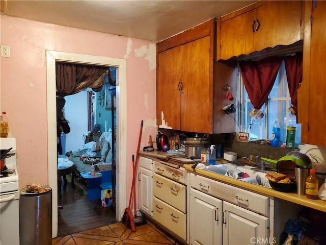 kitchen featuring sink and white cabinets