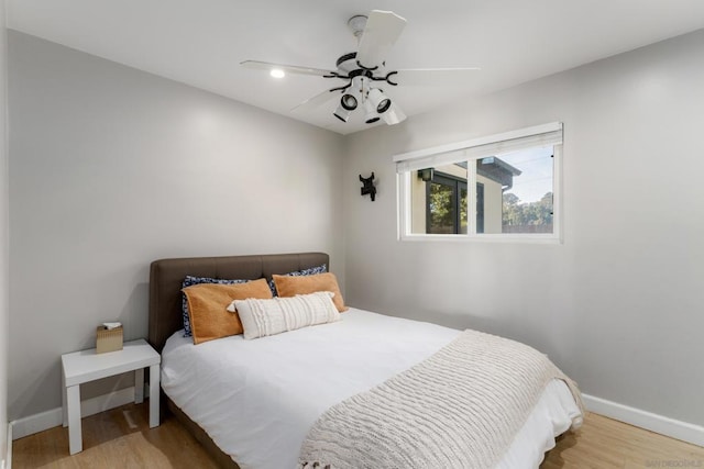 bedroom featuring light wood-type flooring and ceiling fan