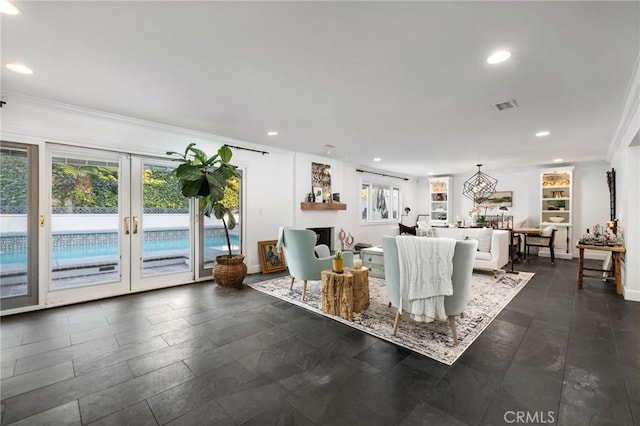 unfurnished living room with ornamental molding, french doors, and a healthy amount of sunlight