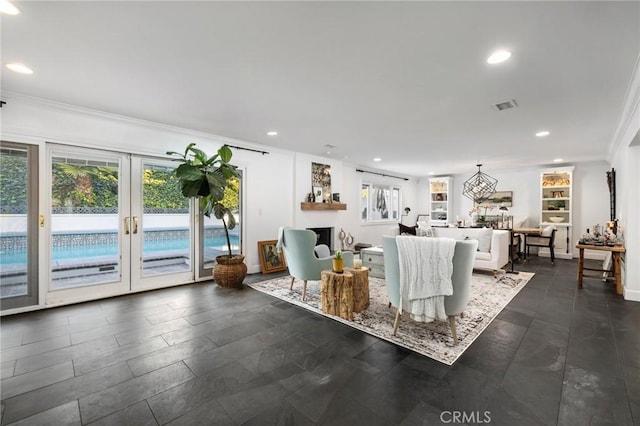 unfurnished living room with crown molding, french doors, and a healthy amount of sunlight