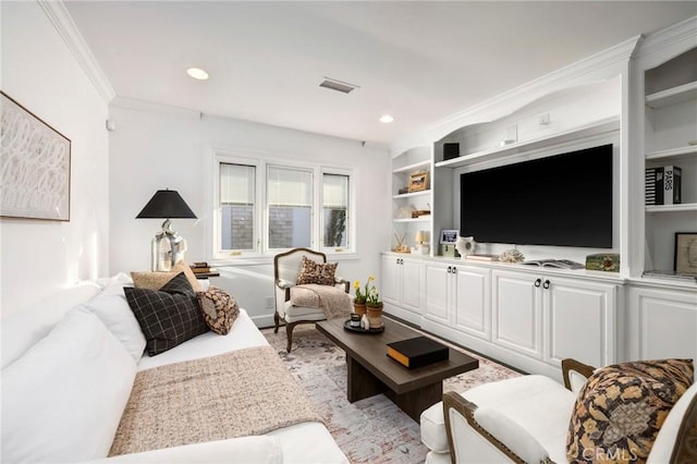 living room featuring built in shelves and ornamental molding