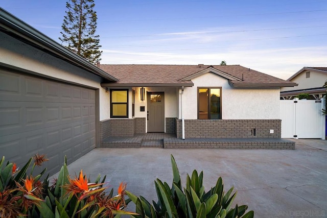 ranch-style house featuring a garage