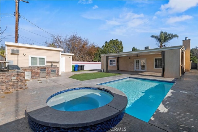 view of pool with ceiling fan, french doors, area for grilling, an in ground hot tub, and a patio area