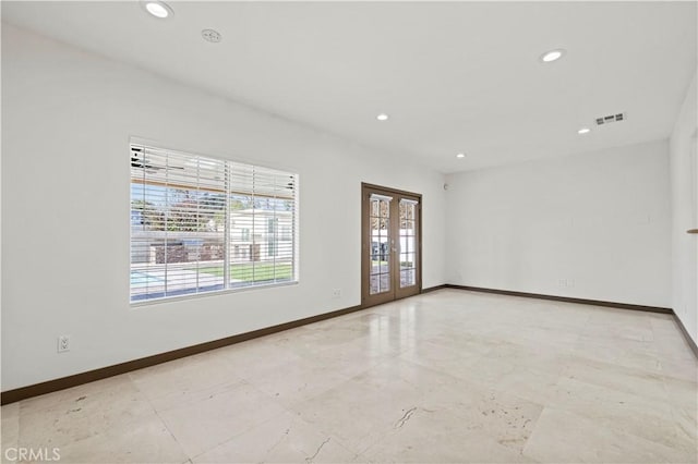 empty room featuring french doors