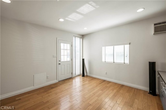 entryway with light hardwood / wood-style flooring