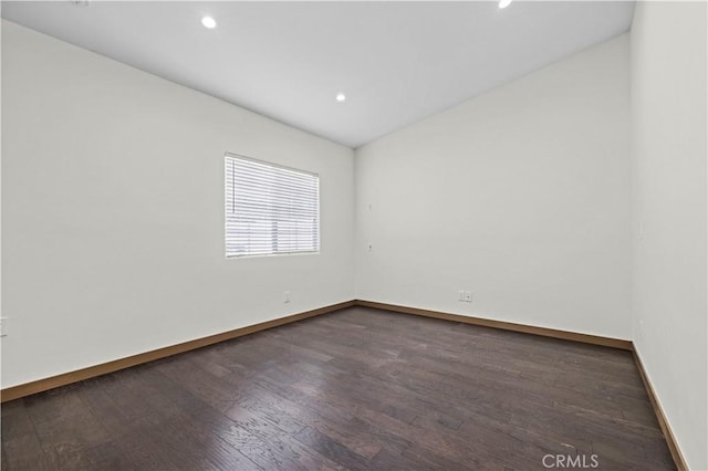 empty room featuring dark wood-type flooring