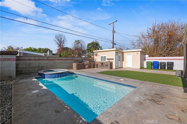 view of swimming pool featuring an in ground hot tub, an outdoor structure, and a patio