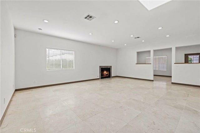 unfurnished living room with a wealth of natural light