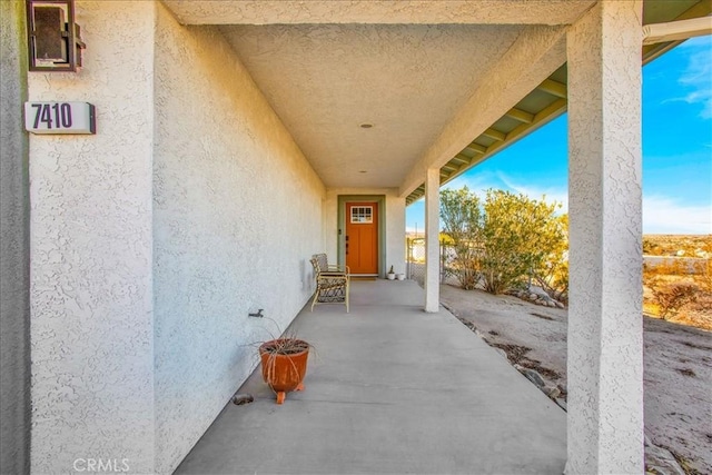 doorway to property with a patio area