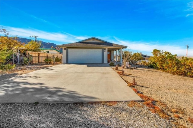 view of front of house with a mountain view and a garage