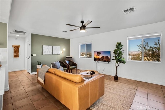 living room with ceiling fan and light tile patterned floors