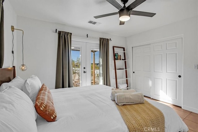 bedroom featuring french doors, a closet, access to outside, ceiling fan, and light tile patterned floors