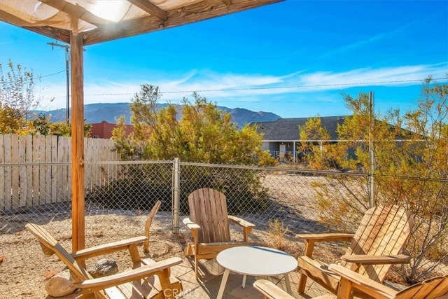 view of patio / terrace featuring a mountain view