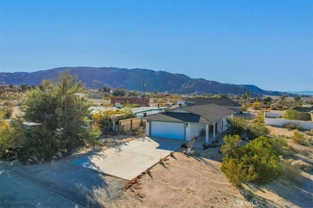 view of front of house with a mountain view and a garage