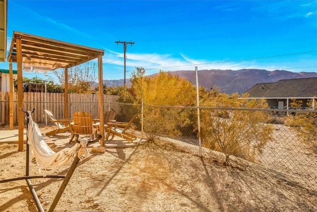 view of yard with a mountain view and a patio