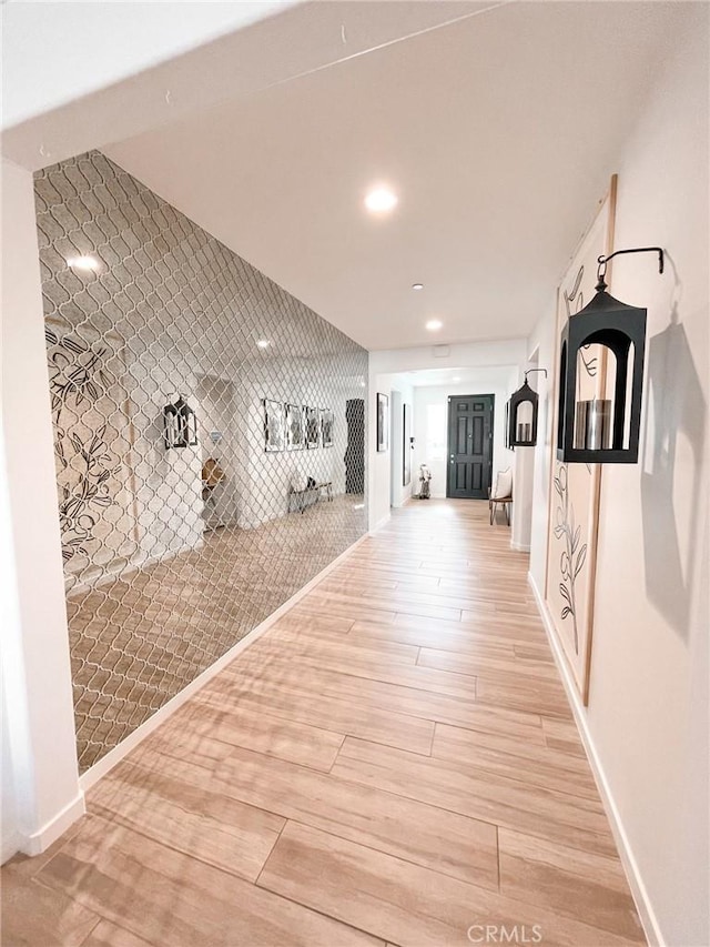 hall with light hardwood / wood-style floors