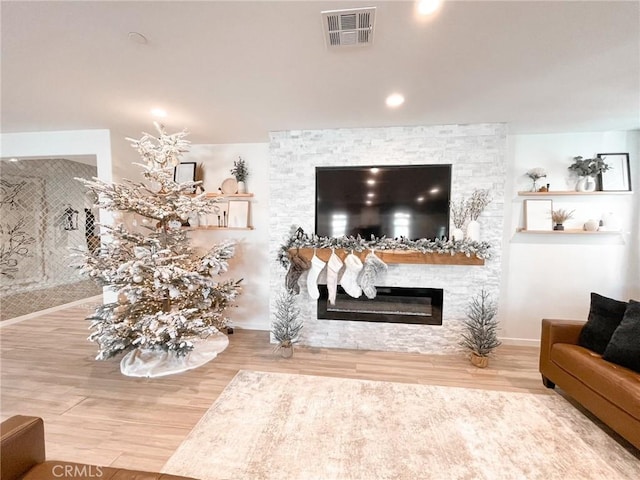 living room featuring hardwood / wood-style floors and a fireplace