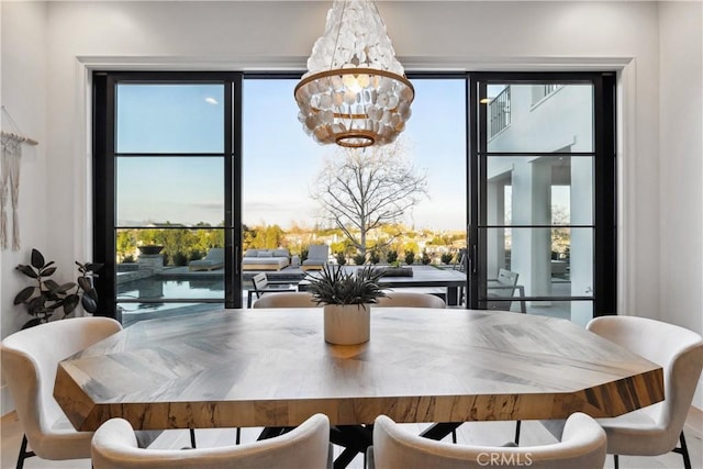 dining room with a notable chandelier