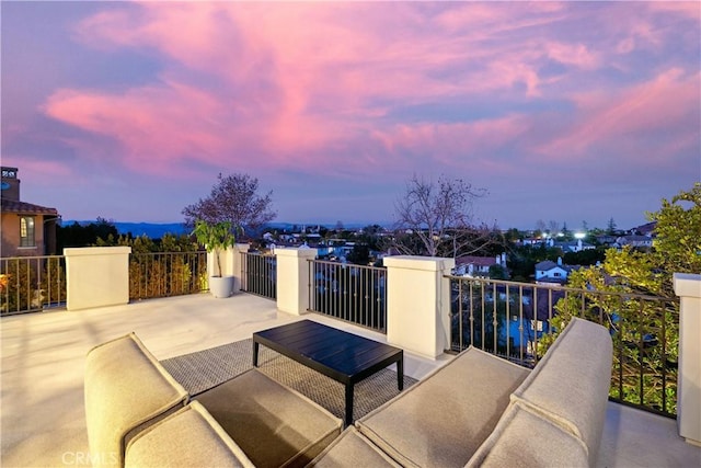 patio terrace at dusk with a balcony