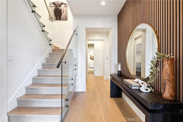 stairs featuring hardwood / wood-style flooring