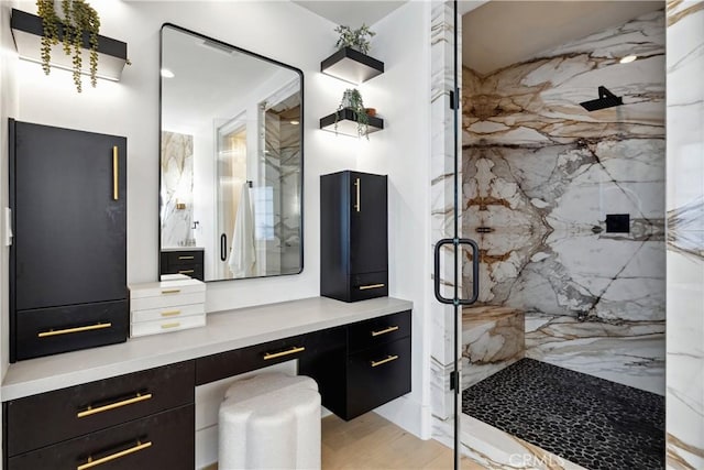 25551 Prado De Oro, Calabasas, CA 91302 - bathroom featuring a marble finish shower, vanity, and wood finished floors
