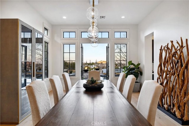 dining room featuring visible vents and recessed lighting