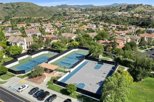 birds eye view of property with a mountain view