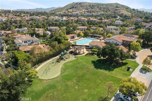 birds eye view of property with a mountain view