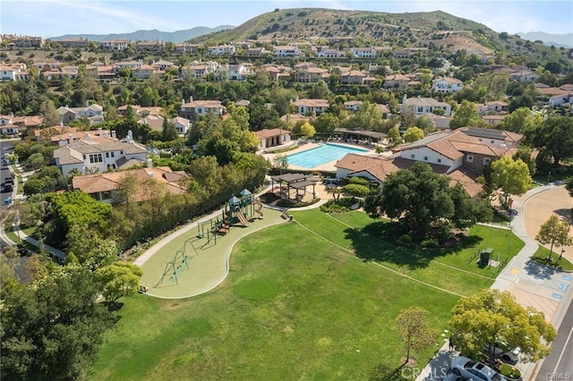 25551 Prado De Oro, Calabasas, CA 91302 - aerial perspective of suburban area featuring a mountainous background, a pool area, and a park