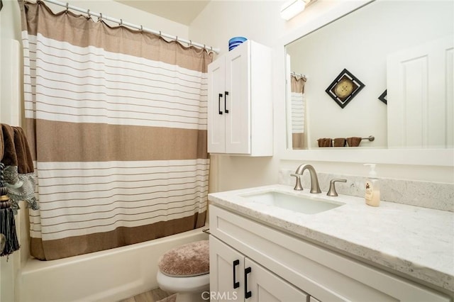 full bathroom with vanity, toilet, and shower / tub combo with curtain