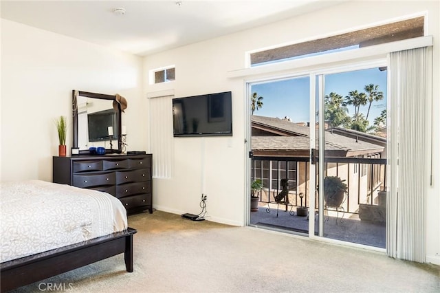 carpeted bedroom featuring access to outside