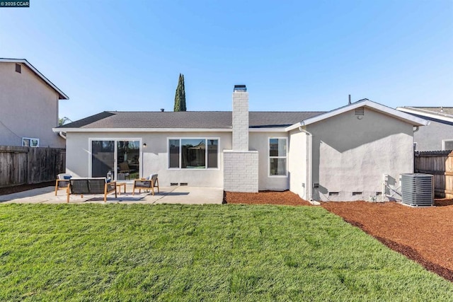 back of house featuring a lawn, central air condition unit, a patio, and an outdoor hangout area