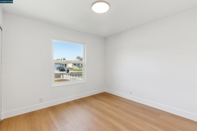 spare room featuring hardwood / wood-style flooring