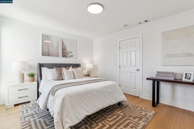 bedroom with light hardwood / wood-style flooring