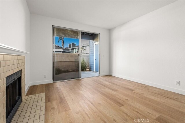 unfurnished living room with light hardwood / wood-style floors