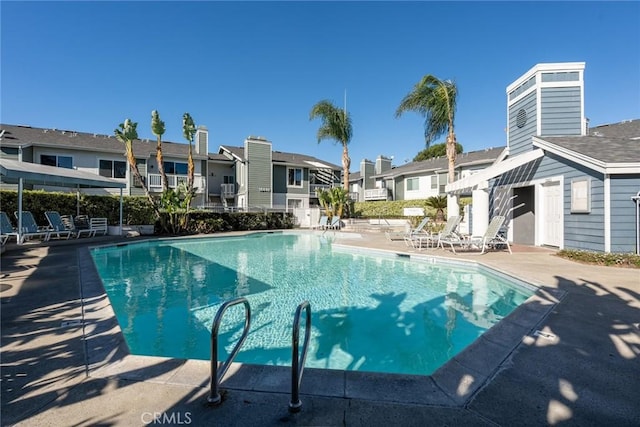 view of swimming pool with a pergola and a patio area