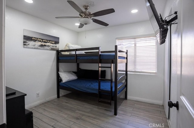 bedroom with ceiling fan and hardwood / wood-style floors