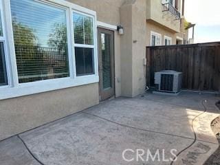 view of patio with central AC unit