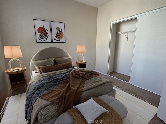 carpeted bedroom with a closet