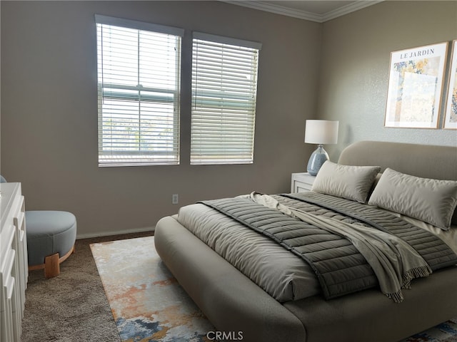 carpeted bedroom featuring ornamental molding and multiple windows