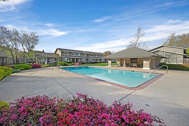 view of swimming pool with a patio area