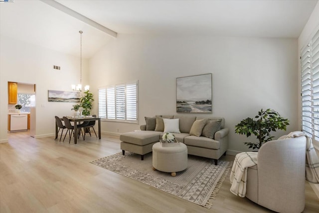 living room with light hardwood / wood-style flooring, beamed ceiling, high vaulted ceiling, and a notable chandelier