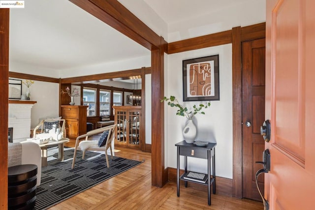 entrance foyer with hardwood / wood-style flooring and a notable chandelier