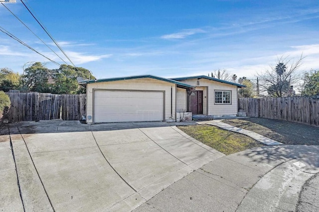 ranch-style home with a garage