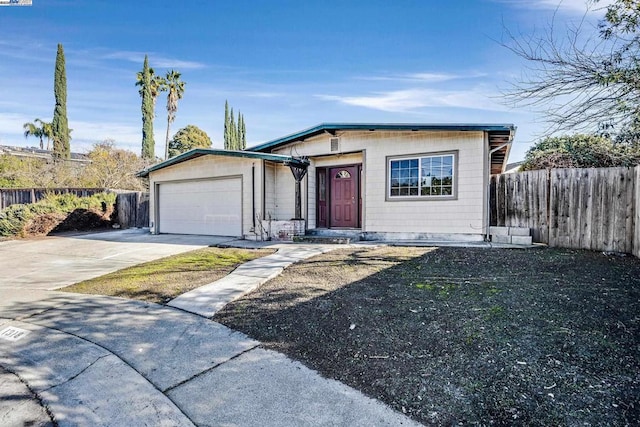 ranch-style home featuring a garage