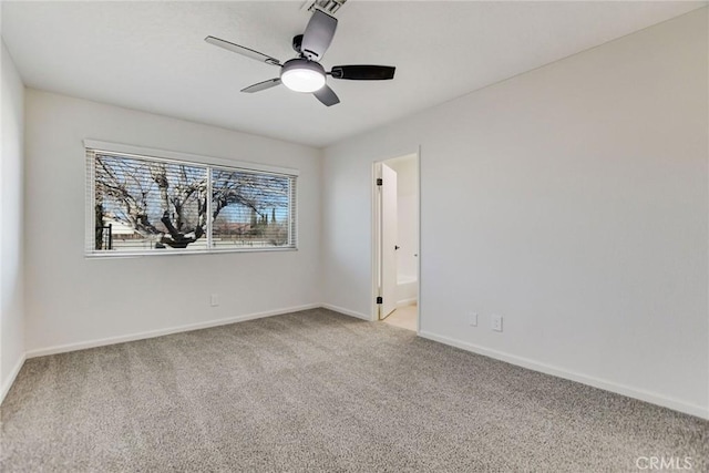 unfurnished room featuring ceiling fan and carpet